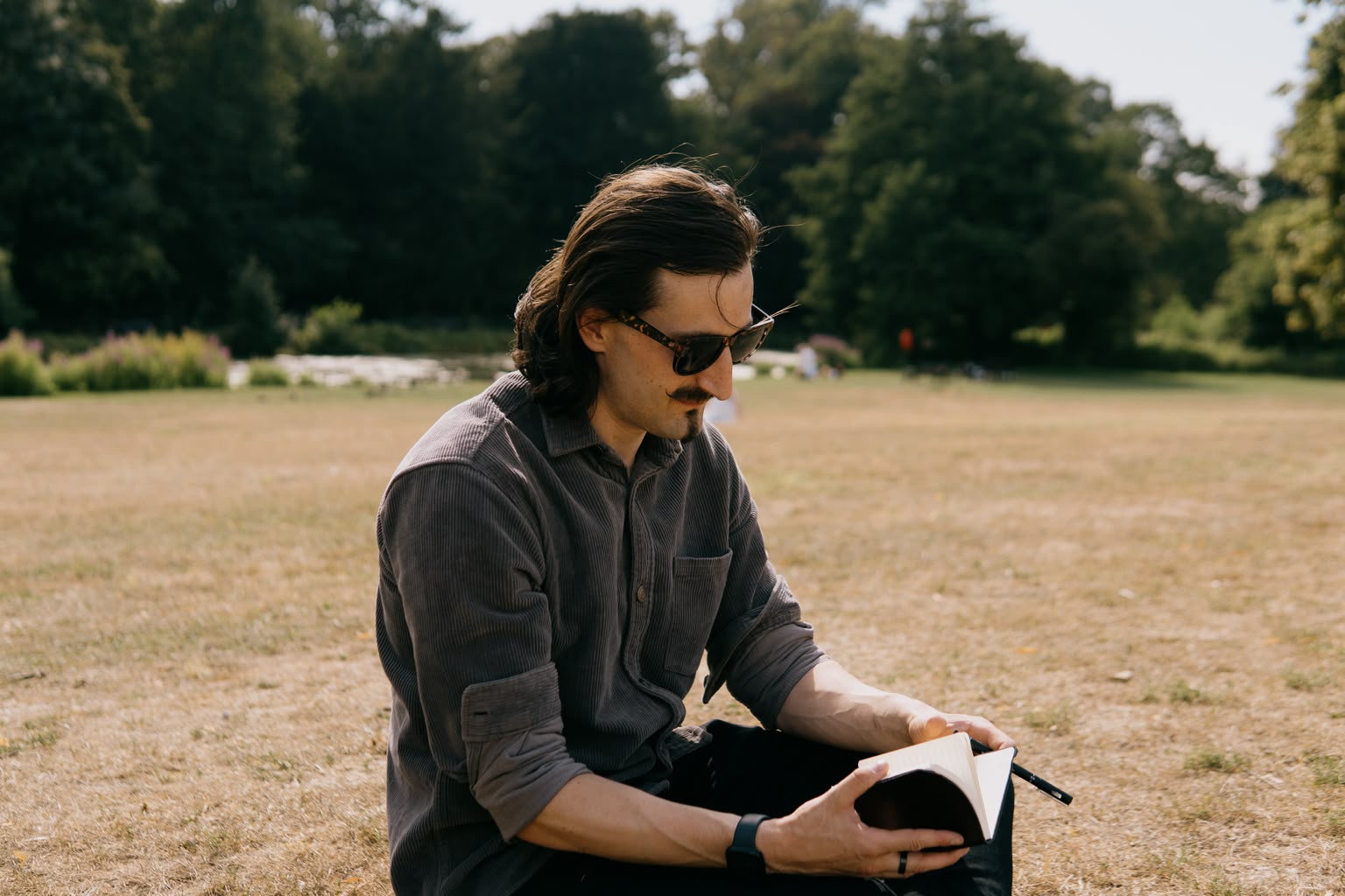 Alex Gunn beside a lake